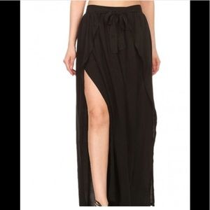 Black gauzy pants with slits up the legs